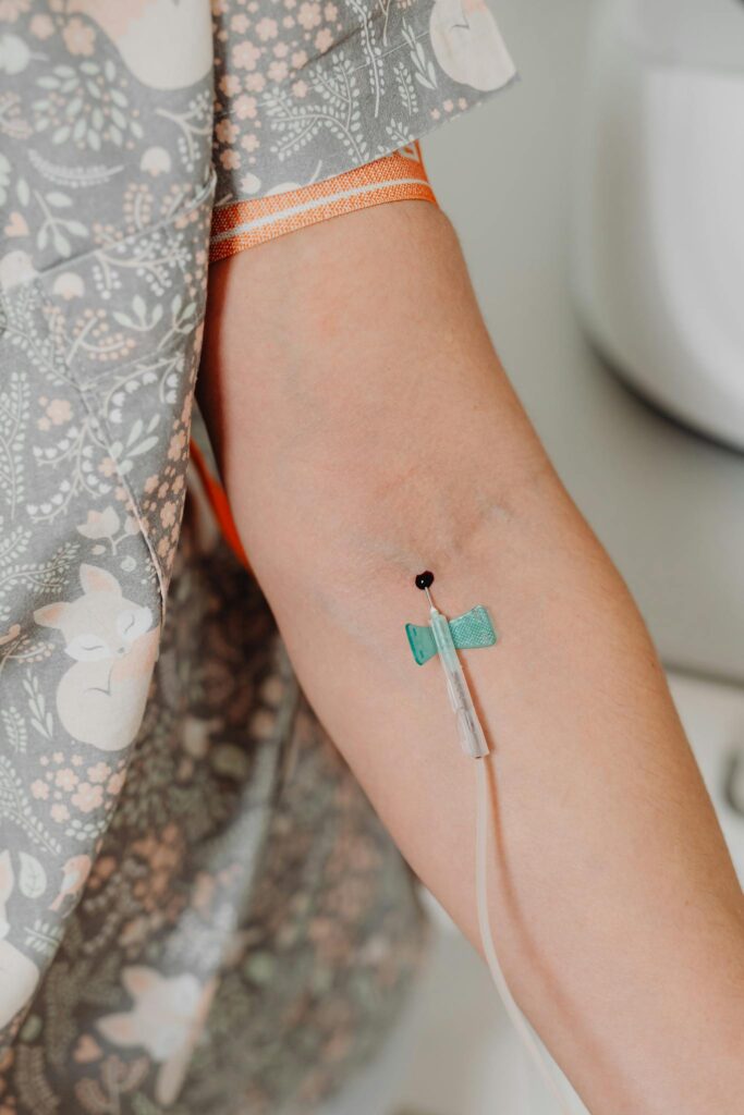 Close-up image of a woman receiving an injection in a healthcare setting.
